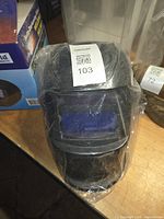 Helmet in clear plastic bag showing lens area