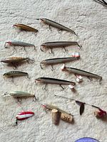 Group shot of all lures and cork pieces on carpet