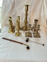 Group shot showing all candlesticks, snuffers and accessories