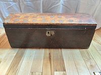 Full view of rectangular wooden trunk closed