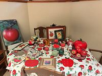 Overall view of apple-themed items on table