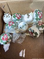 all nine knobs inside box, variety of wrapped and unwrapped