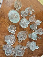 Overhead view of full collection of clear pressed glass pieces on table