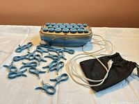 Base, rollers, clips, pouch and power cord overview