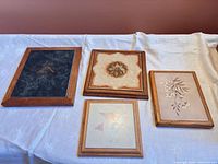 Group shot of all four framed ceramic tiles