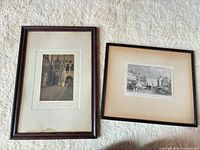 Both framed prints side by side showing overall frames and mat condition