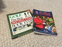 Front covers of both softcover books displayed on carpet