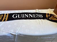 Full length view of Guinness scarf laid flat