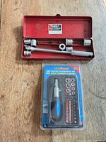 Husky metal case open with handle, sockets and ToolDeals packaged set visible