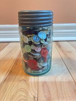 Front view of jar showing buttons and aqua tint