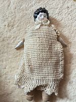 Full view of doll showing knit dress and cloth body
