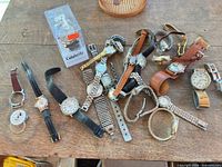 Overview of all wristwatches and Celebrity display stand on table