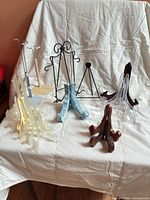 Group shot of all easels and stands on white cloth