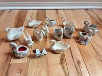 Group shot of all eleven ceramic items on wood floor
