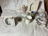 Group shot of all nine decorative items arranged on cloth background