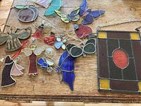 All items on table showing variety of suncatchers and panel