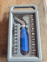 Closed case with clear lid showing contents