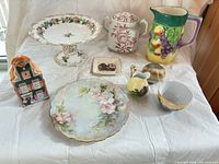 Group shot of all eight porcelain and ceramic pieces