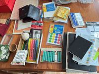 Overview of lot showing wallets, labels, highlighters, pastels and folders