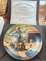 Full view of plate with certificate showing title, artwork, and edition details