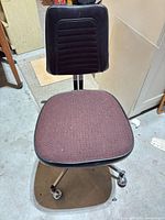 Full view of chair showing seat, backrest, frame