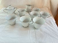 Group view of cups, creamer, sugar bowl