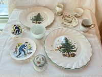 Group view of all ten assorted porcelain pieces on table