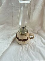Full view of ceramic oil lamp with chimney