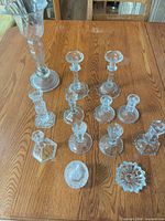 Group shot of all glass candlesticks on table