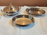 All three silver-plated serving pieces displayed together