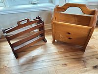 Both wooden magazine racks side by side on floor