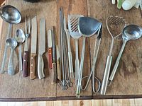 All utensils laid out on wooden surface