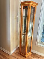full view of curio cabinet closed