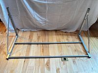 Full view of silver metal frame assembled on floor
