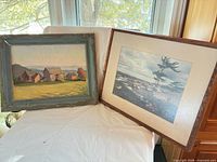 Both framed artworks side by side showing size and framing