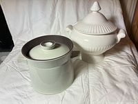 Overall shot of soup tureen and stoneware crock side by side