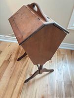 Sewing box full view showing octagonal cabinet, handle and stand