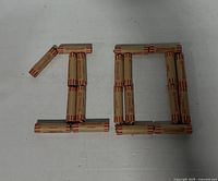 Rolls of pennies arranged to depict "10" indicating total face value $10