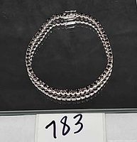 Bracelet laid in oval showing full length and clasp