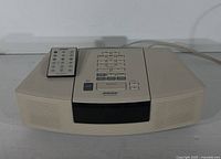 Front view of Bose Wave Radio/CD with remote on top