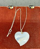 Necklace and both earrings displayed together for full lot view