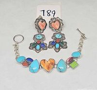 Front view of bracelet and earrings showing stones and metal