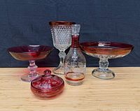 Group shot of all five ruby flashed glass pieces