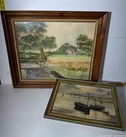 Both framed paintings side by side showing relative sizes and styles