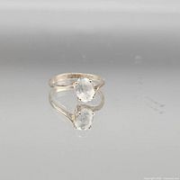 Full view of sterling silver ring with clear oval stone