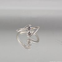 Full view of sterling silver bypass ring showing two stones