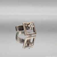Full view of sterling silver square floral ring