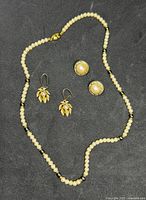 Necklace and both earring pairs overview