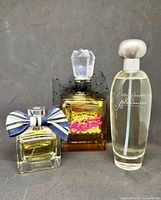 Three perfume bottles front view