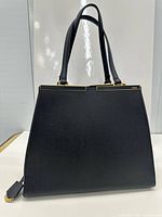 Front view of black Fendi 3Jours tote showing leather texture and gold frame